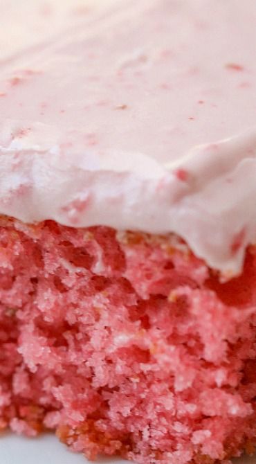 a close up of a piece of cake with frosting on the top and bottom