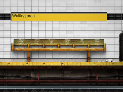 a subway station with a bench and trash can on the platform, waiting area sign above