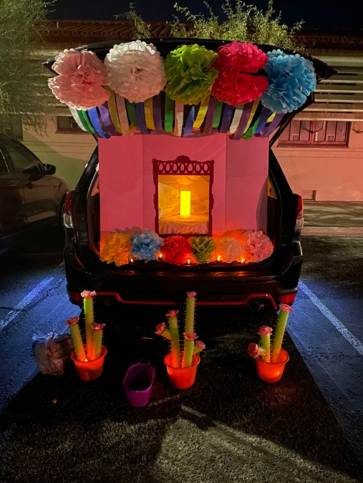 a car is decorated with flowers and candles