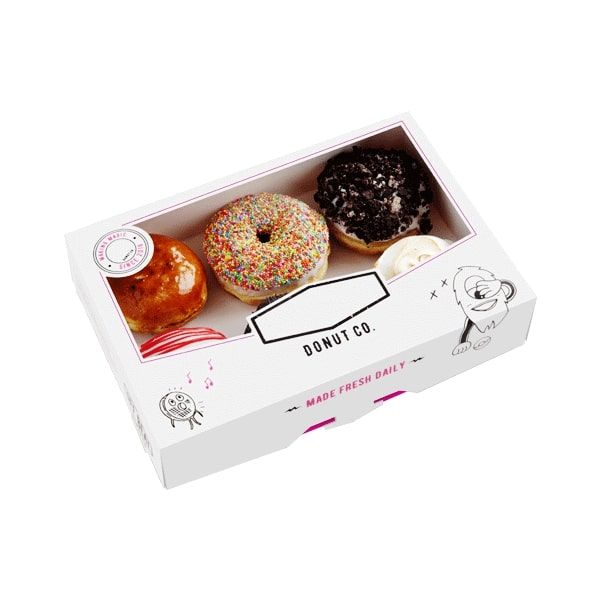 an open box of donuts with frosting and sprinkles