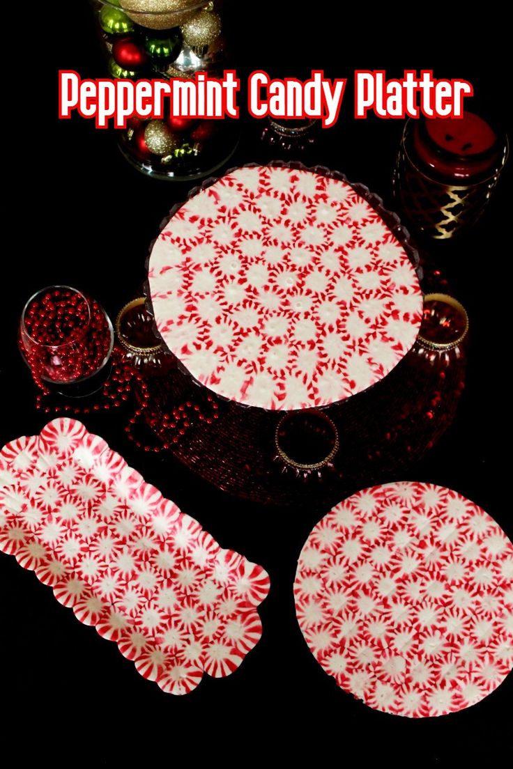 peppermint candy platter with red and white designs on it, surrounded by other christmas decorations