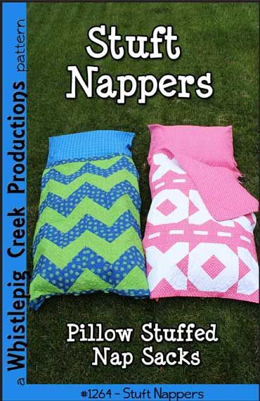 two pillows sitting next to each other on top of green grass with the words pufft nappers written below them