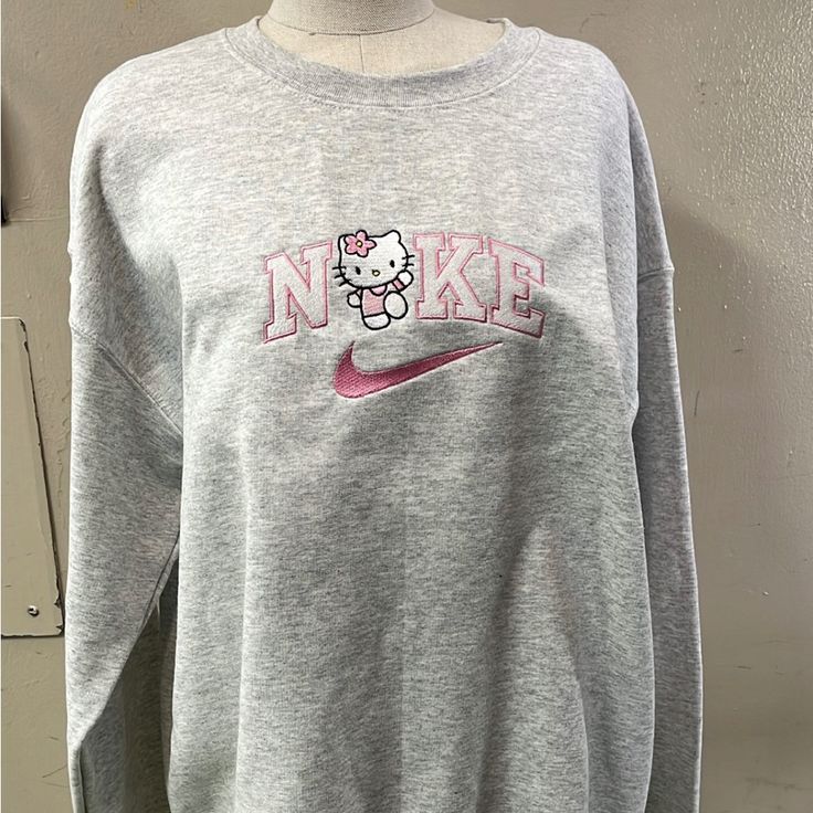 Nike Hello Kitty Crew Neck Sz L Embroidered Nike Jumpera, Cheap Black Top With Hello Kitty Print, Cheap Red Hello Kitty Tops, Cheap Red Hello Kitty Print T-shirt, Cheap Hello Kitty T-shirt For Summer, Cheap Fun T-shirt With Hello Kitty Print, Cheap Black Hello Kitty Print Top, Cheap Hello Kitty Graphic Tee, Cheap Cotton Hello Kitty Tops