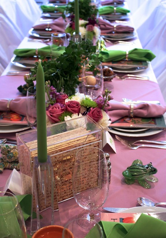 a long table is set with place settings and napkins