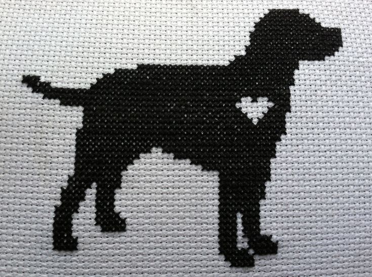 a black dog with a heart on it's chest is depicted in the cross stitch pattern