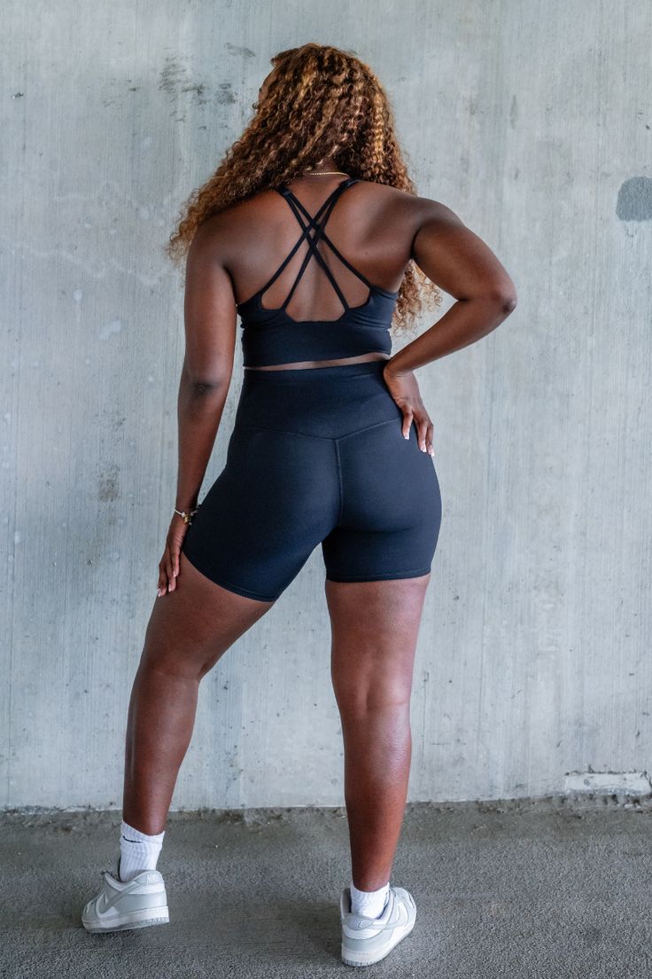 Stay comfortable and stylish during your workout with our OTG Short Sets in Black. Crafted with buttery smooth fabric, these sets include supportive bras with criss cross detailing for added style and functionality. Perfect for any fitness routine, experience the ultimate comfort and support while looking your best. Inseam 6 Inches Similar material than as Royal but not the same. Slightly thicker Black Cross Back Activewear With Built-in Padding, Black Activewear With Built-in Bra For Pilates, Casual Activewear With Built-in Padding And Supportive Fit, Fitted Crisscross Activewear With Built-in Bra, Strappy Back Yoga Activewear With Built-in Padding, Cross Back Gym Activewear With Built-in Padding, Cross Back Activewear With Built-in Padding For Gym, Gym Activewear With Built-in Padding And Cross Back, Stretch Biker Shorts With Built-in Bra For Workout