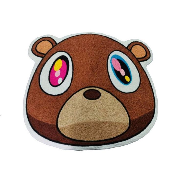 a brown bear with big eyes on it's face