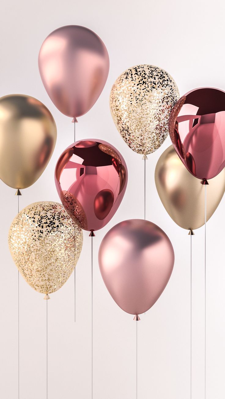 several balloons with gold and pink foil on them