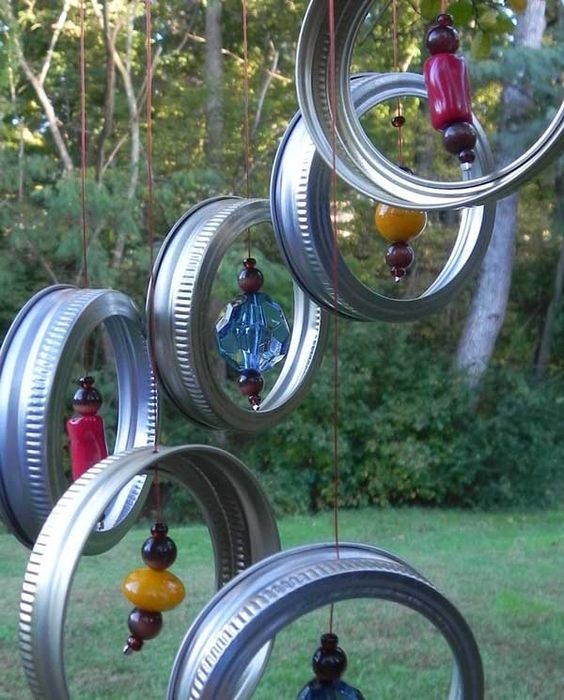 a wind chime hanging from the side of a tree