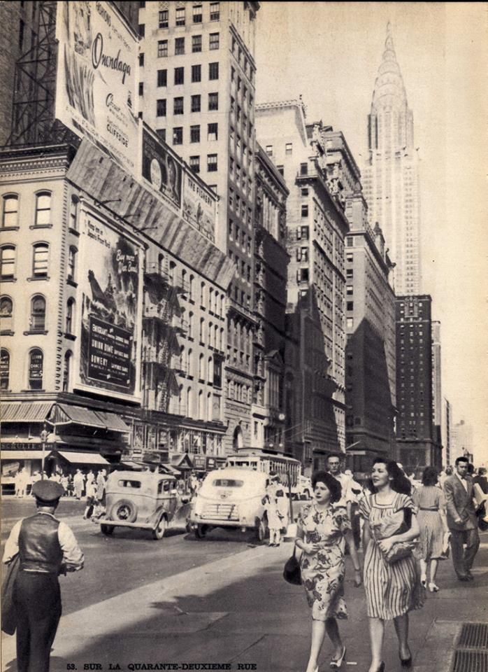 an old black and white photo of people walking down the street in new york city