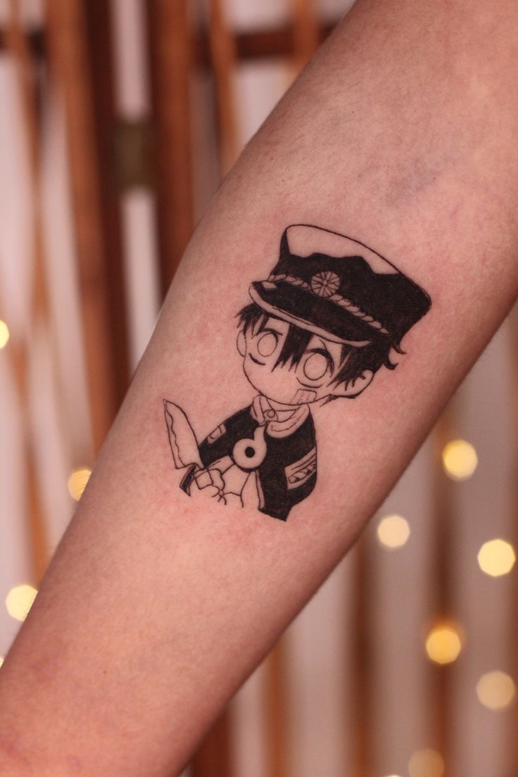 a person with a tattoo on their arm holding a knife and looking at the camera