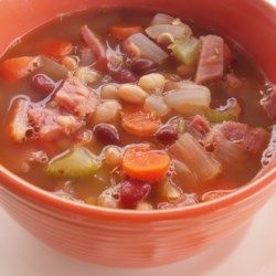 a bowl filled with soup sitting on top of a table