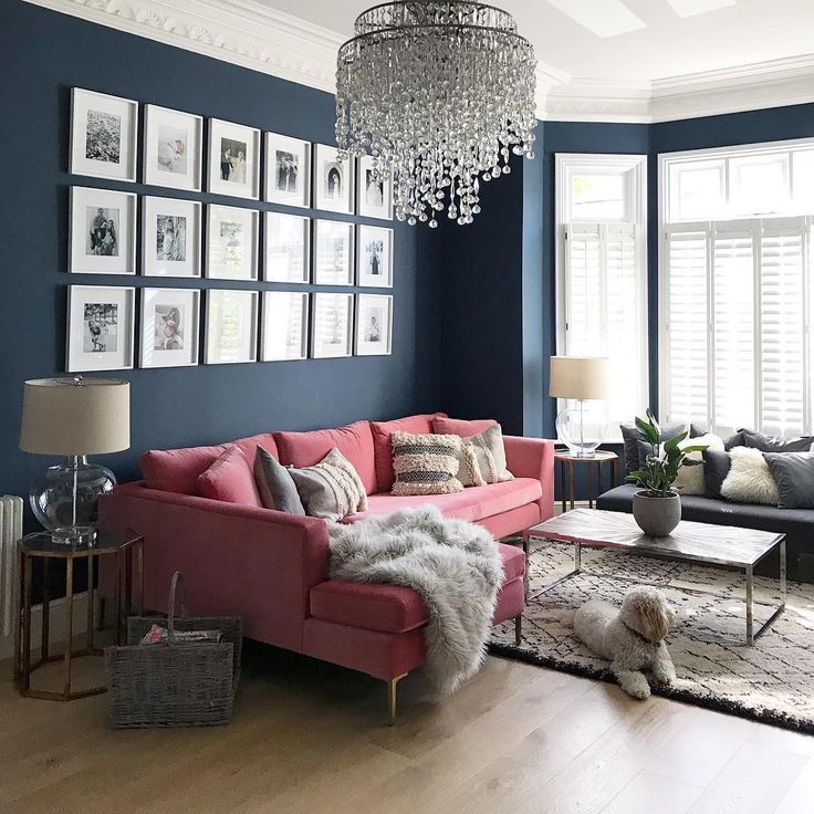 a living room filled with furniture and a chandelier