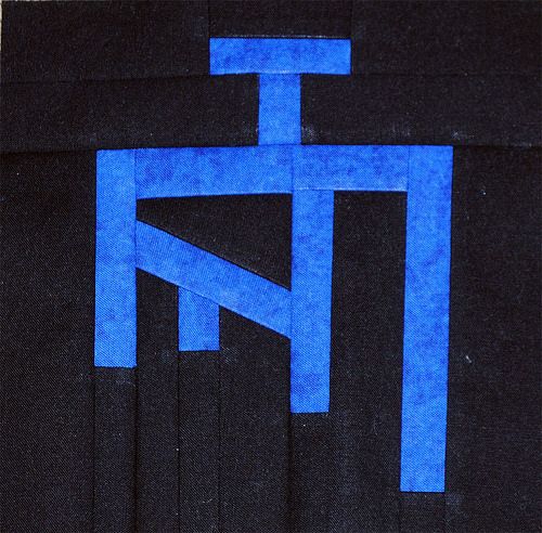 an abstract painting with blue lines on black paper