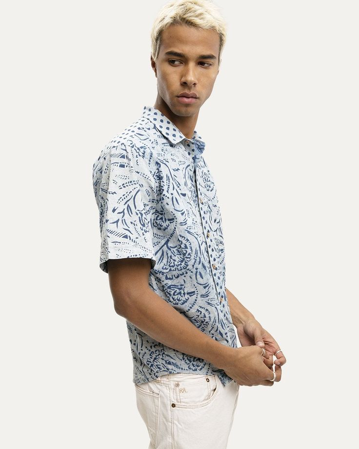 Short sleeve cotton shirt featuring a point collar, scalloped hem, coconut button closure, chest patch pocket, Indigo dye, block print. Due to the dyeing process, we recommend sizing up. MADE IN INDIA. DAOUDA IS 6'1 AND WEARING A MEDIUM. MR149-09GZ-131 Summer Tie-dye Cotton Shirt, Printed Cotton Shirt With Spread Collar, Cotton Block Print Relaxed Fit Top, Cotton Block Print Tops With Relaxed Fit, Cotton Camp Shirt With Placket, Blue Cotton Camp Shirt With Spread Collar, Casual Patterned Shirt With Spread Collar, Printed Cotton Button-up Shirt, Printed Cotton Shirt With Camp Collar