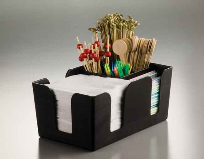 a black and white desk organizer with toothbrushes in it