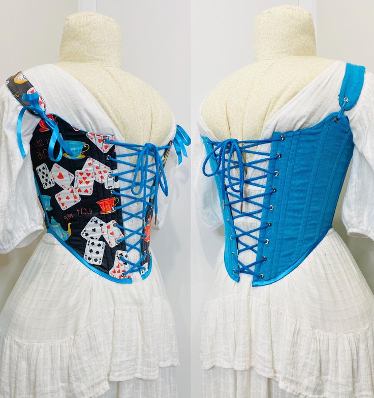 This corset is inspired by the classic 18th century shape with a few modern twists On one side the corset is a Alice in wonderland themed cotton print, the other a bright blue corduroy.  Comes with two matching ribbons and a 2m cotton cord A fabulous addition to any wardrobe and made of 80% recycled fabrics This is a finished item available in only one size, it's closed measurements are Bust - 33" Waist- 26" Size appropriate SM if you are unsure about sizing or have any other questions please co Blue Overbust Corset Dress For Costume Party, Blue Corset Dress With Fitted Bodice, Blue Fitted Corset Dress For Costume, Blue Overbust Corset For Costume Party, Fitted Overbust Corset Dress For Festival, Fitted Overbust Corset Belt For Festivals, Blue Fitted Corset For Costume Party, Festival Overbust Corset With Fitted Bodice, Festival Fitted Overbust Corset Belt