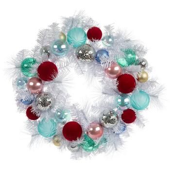 a christmas wreath with ornaments hanging from it's side on a white background,