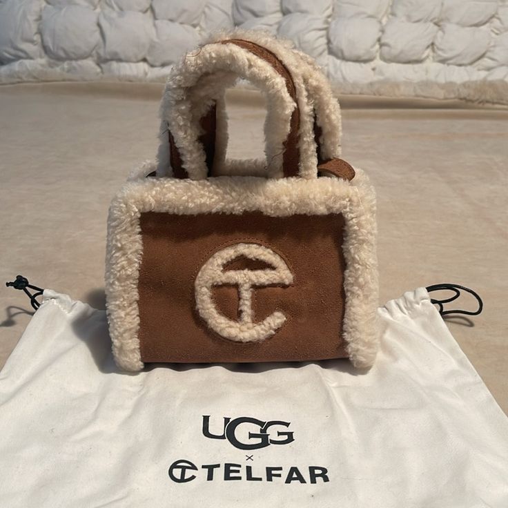 Nwot Ugg X Telfar Small Shopper First Drop Classic Brown Leather With Cream Sheepskin Trim & Logo; Comes With Original Dust Bag Dimensions: 4 3/4” H X 6 5/8” W X 3 1/8 D, 21” Drop Luxury Tote Bag For Winter, Luxury Winter Shoulder Bag For Shopping, Designer Bags For Everyday Use In Winter, Designer Leather Bags For Winter, One Drop, Brown Leather, Dust Bag, Bag Lady, Cream