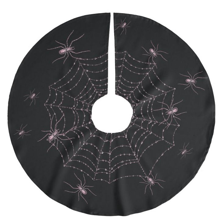 a spider web pattern on a black background with pink and white dots in the center