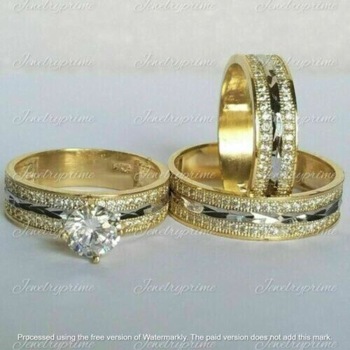 two gold wedding rings with diamonds on each one and an engagement ring in the middle