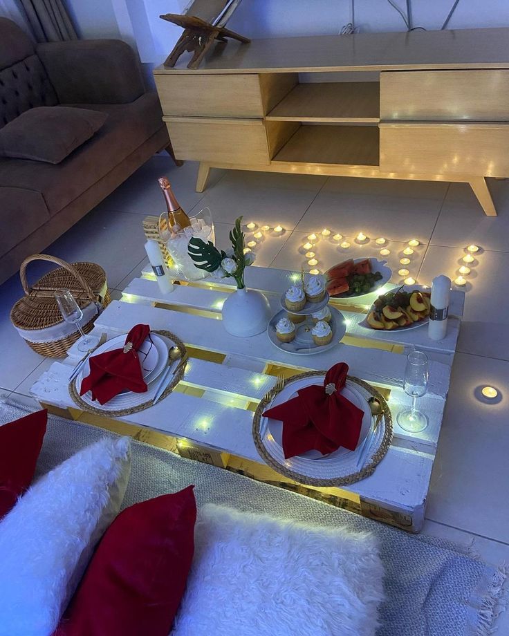 a living room filled with lots of furniture and christmas decorations on top of a coffee table