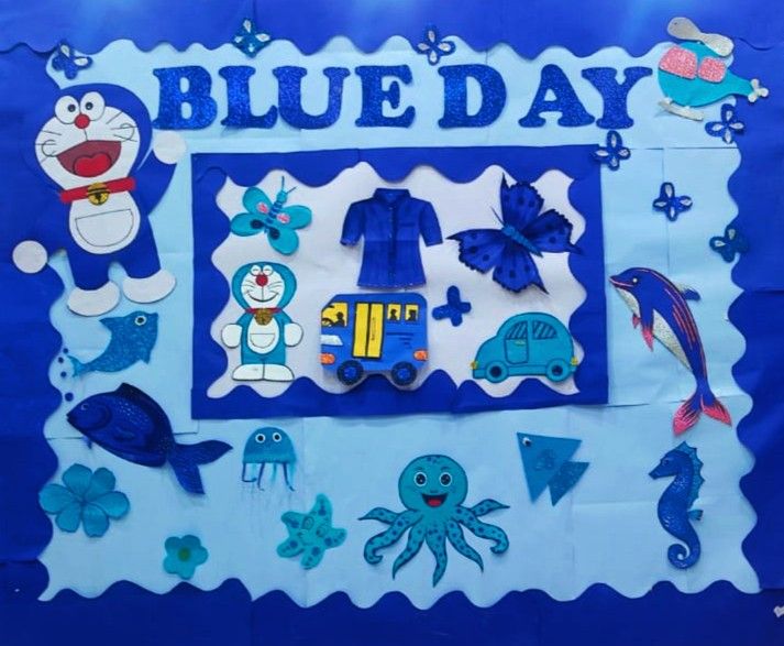 a bulletin board with blue day decorations on it and an octopus, fish, crab, turtle