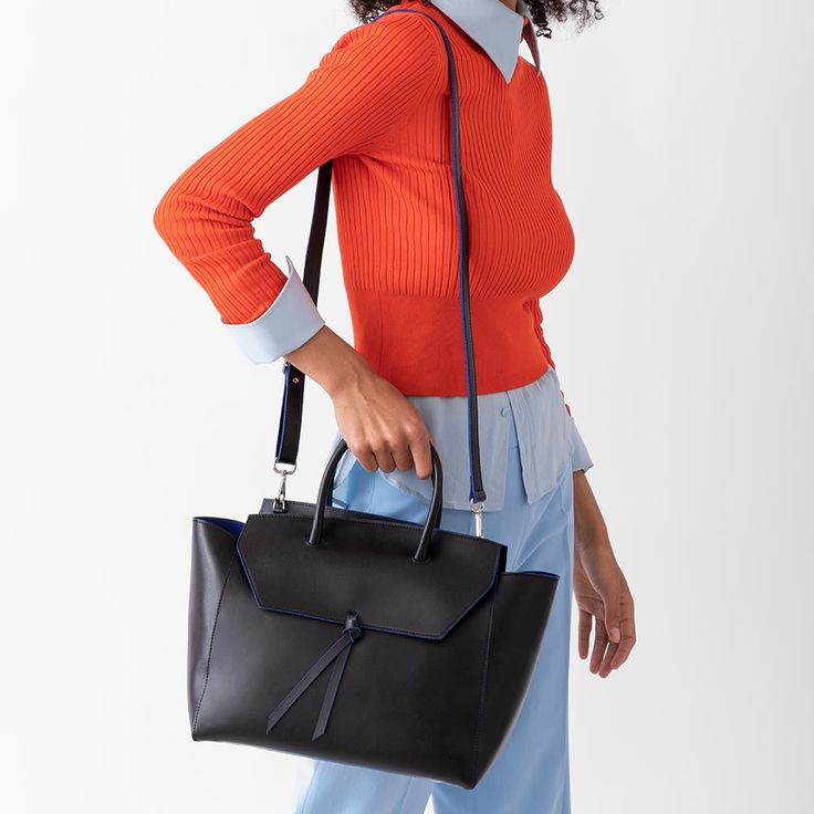 Are you ready to be that stylish woman who walks into the office with one leather tote that does it all? The Loren Tote is the ultimate everyday work bag because it’s made with our signature lightweight Italian leather that holds its shape over time, doesn’t scratch and is easy to clean. Plus, it’s spacious, stylish and so lightweight, that it won’t break your back. Rectangular Satchel With Removable Pouch For Work, Workwear Laptop Shoulder Bag With Leather Handles, Chic Laptop Shoulder Bag With Leather Handles, Sleek Satchel With Detachable Strap In Tote Shape, Black Tote Briefcase With Detachable Handle, Sleek Satchel With Detachable Strap In Tote Style, Black Briefcase Tote With Detachable Handle, Chic Tote Briefcase With Leather Handles, Chic Satchel Laptop Bag With Leather Handles