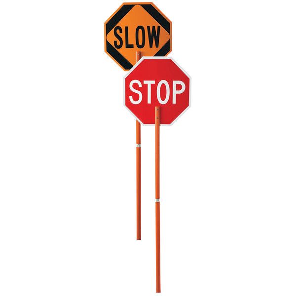 two stop signs on top of each other with the word slow written below one sign