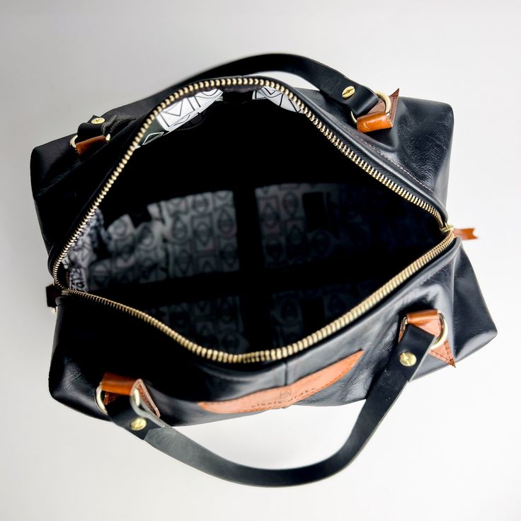 Our Everyday Collection of handbags reflects our task, offering tried + true styles + combinations that are timeless + classic. Colors + sizes to keep up with your effortless style + quality that holds up to your everyday adventures. Meet Eliza. She can manage it all with such style + grace + a visit or 2 to Wyoming---a nod to the late Queen. In my dreams, we would meet for tea + would sit + visit about silly things, like which tarts + cakes were her favorite---pretty sure they all would be my f Everyday Rectangular Duffle Bag With Leather Handles, Rectangular Duffle Bag With Leather Handles, Modern Travel Satchel With Leather Lining, Everyday Top Handle Satchel With Leather Handles, Everyday Satchel Weekender Bag With Detachable Strap, Everyday Tote Duffle Bag With Leather Lining, Leather Lined Satchel Weekender Bag For On-the-go, Leather-lined Tote Duffle Bag For Everyday Use, Everyday Travel Satchel With Detachable Strap