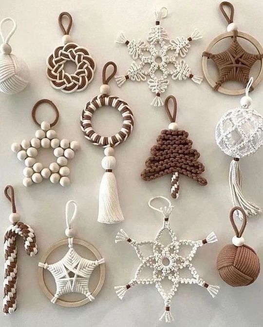 many different ornaments are arranged on a white surface with one ornament in the middle