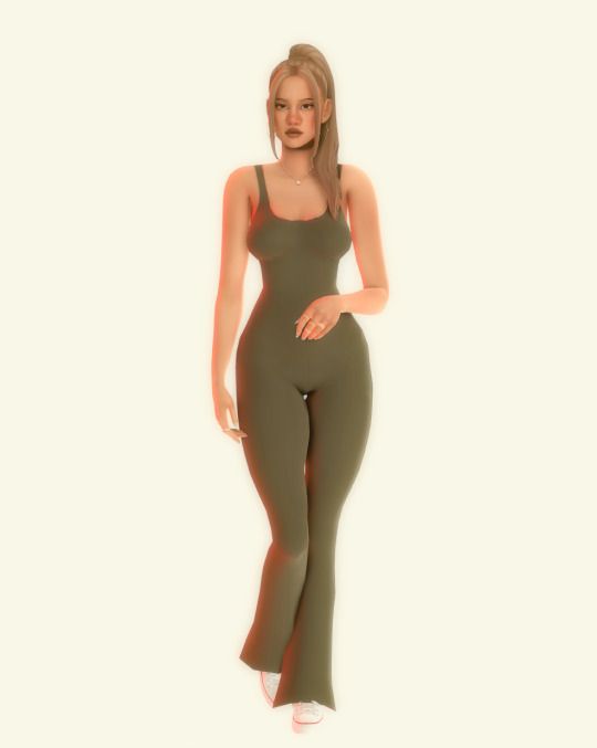 a woman in a green bodysuit posing for the camera with her hands on her hips