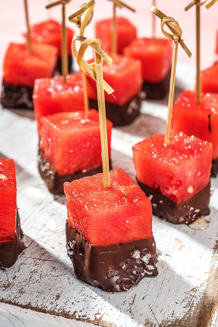 watermelon cubes with toothpicks on top of them