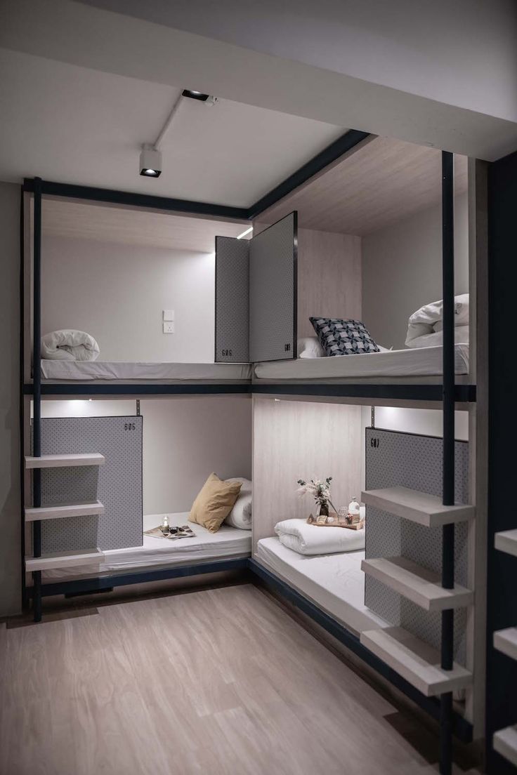 the bunk beds in this small room are made to look like they have been built into each other