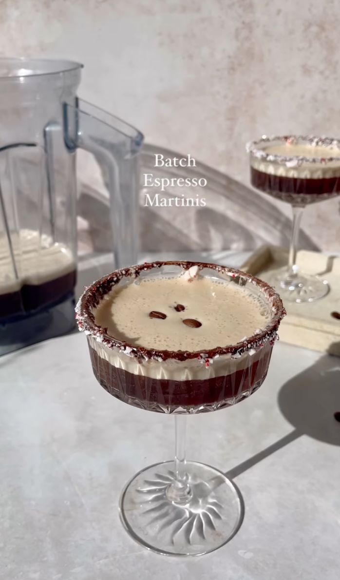 two glasses filled with dessert sitting on top of a counter