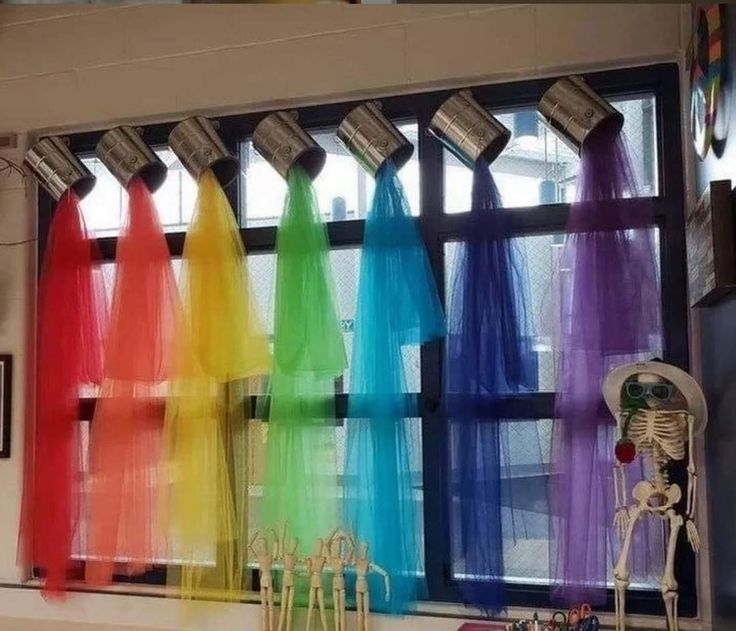 an image of colorful curtains in front of a window with the words, how fun are these curtains for art classroom?