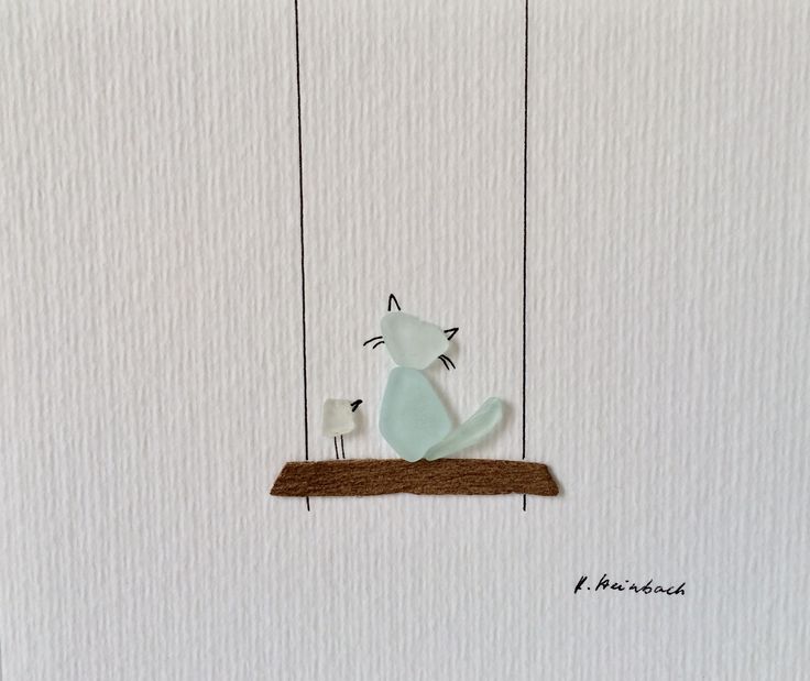 a white cat sitting on top of a wooden swing with two birds perched on it