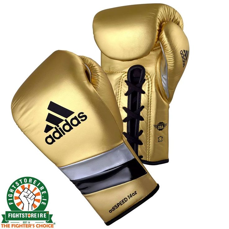 the adidas boxing gloves are gold with black laces and logo on the front