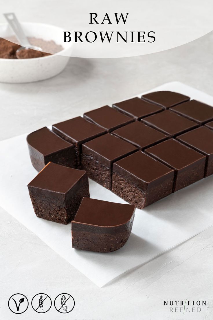 chocolate brownies are arranged on a white plate