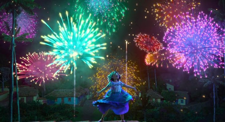 a woman is dancing in front of fireworks