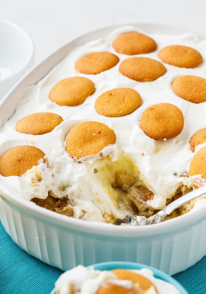 a dessert dish filled with ice cream and pie crusts on top of blue cloth