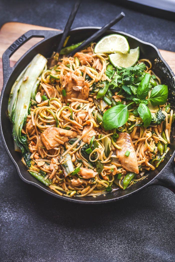 a skillet filled with noodles and vegetables