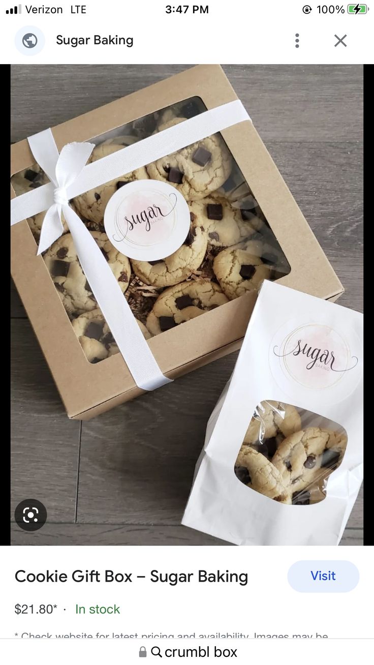 an open box of cookies sitting on top of a table