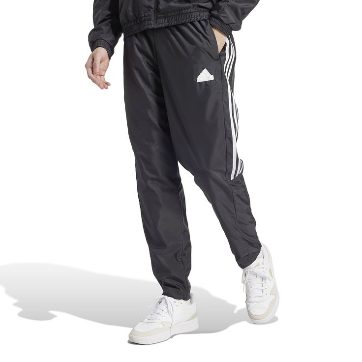 Influenced by the track but made for the streets, the adidas Tiro Woven Men's Pants have a classic style and a relaxed fit. You'll move, stretch, and bend, never feeling an ounce of restraint. Whether you want to keep your hands warm or a few of your essentials handy, you'll have pockets to do just that. Features adidas tri-stripe design. Elastic waistband. Two front pockets. Has logo on left thigh. Adidas Moisture-wicking Joggers For Streetwear, Adidas Gym Pants With Three Stripes, Sportswear Joggers With Three Stripes For Training, Athleisure Joggers With Three Stripes Branding For Training, Sporty Adidas Sweatpants For Training, Adidas Sporty Joggers For Training, Adidas Sporty Training Joggers, Adidas Joggers With Three Stripes For Training, Adidas Jogging Pants With Three Stripes