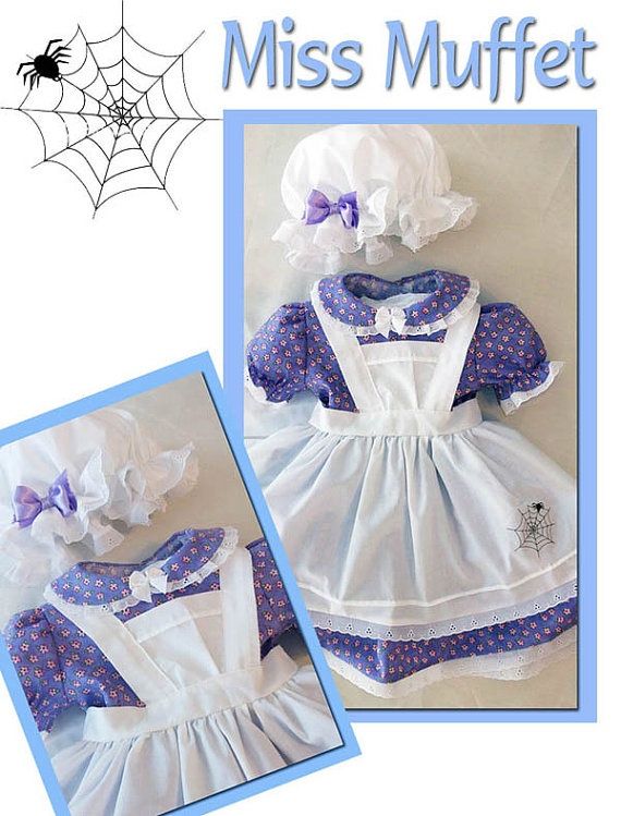 a doll dressed in white and purple with spider webs on it's back