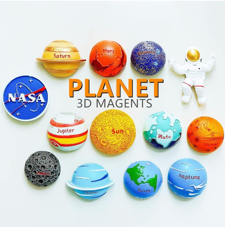 a bunch of magnets that are on top of a white surface with the words planet in it