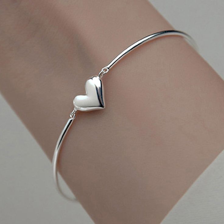 This heart shape bracelet features two bangle piece connected to each order, with adjustable chain, heart shape charm, made of solid 925 sterling silver, a great Valentine gift for your love one. Material: 925 sterling silverFinish: platinum plate Jewelry Care: See more information about how to care for your jewelry here. Shipping Policy: Orders will be shipped within 1-3 business days. Economy shipping will take 7-14 days to arrive and standard shipping is 1- 4 days for U.S. orders. Internation Heart Shape Bracelet, Plate Jewelry, Chain Heart, For Your Love, Valentine Gift, Valentine Heart, Jewelry Plate, Heart Shape, Solid 925 Sterling Silver