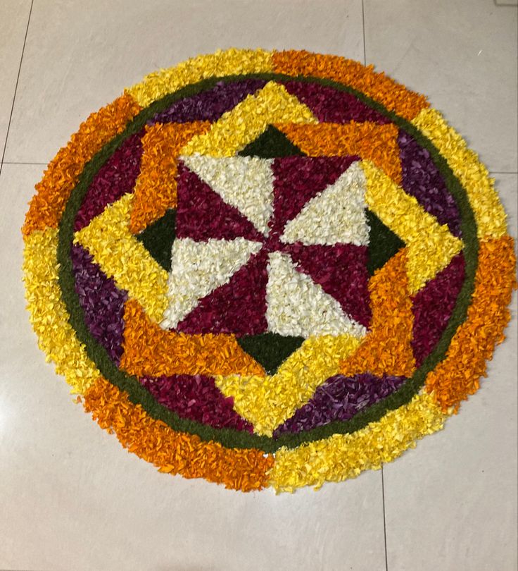 a circular flower arrangement on the floor