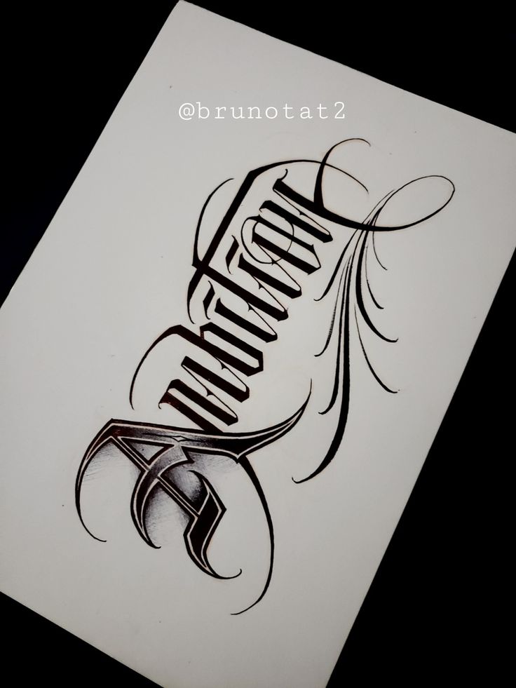 an old school tattoo design with the word's name in cursive writing