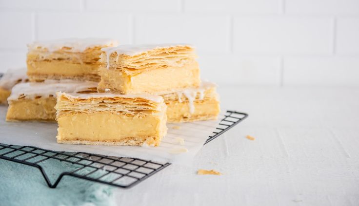 several pieces of cake sitting on top of a cooling rack